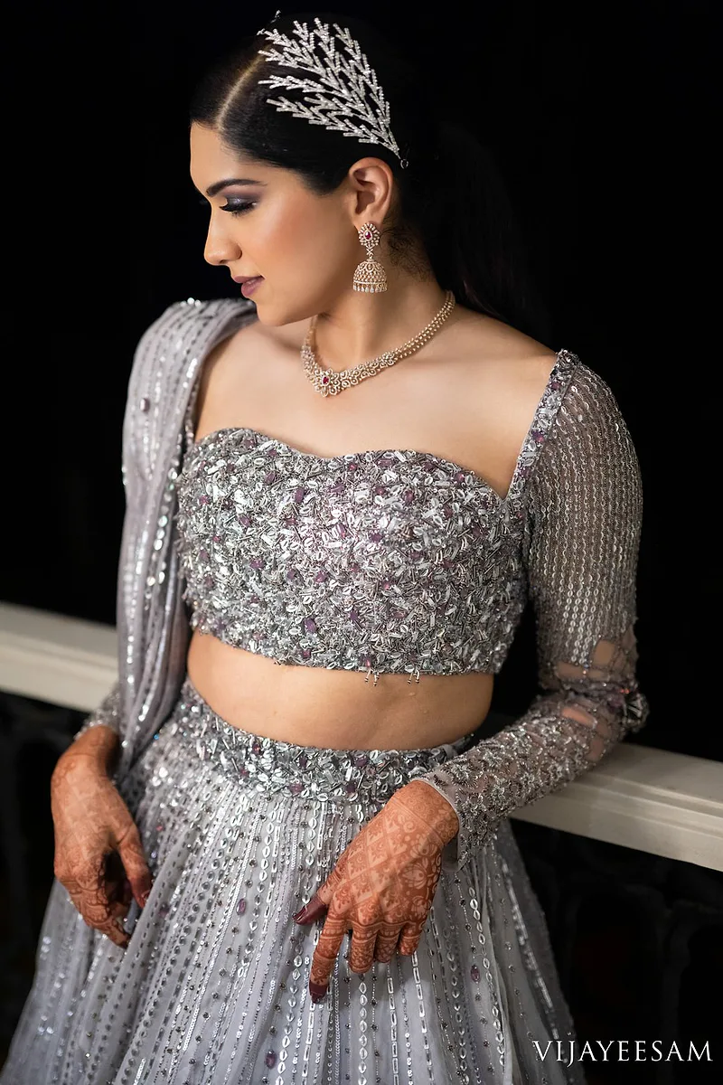 Ethereal Silver Lehenga Reception Bride - Dejavu Makeup Studio Bangalore bride in silver lehenga with bridal makeup and luminous highlight.