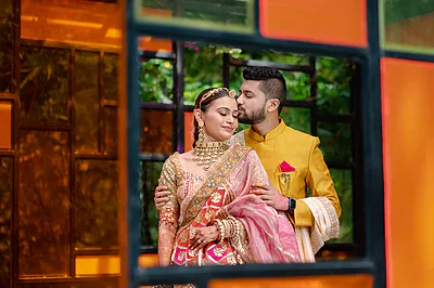 Bangalore bride in pink lehenga with bridal makeup and luminous highlight.