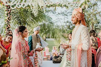 Bangalore bride in a pink lehenga with bridal makeup and a dewy finish.